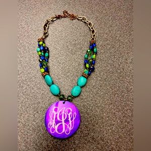 AJV monogrammed purple, teal and green necklace.